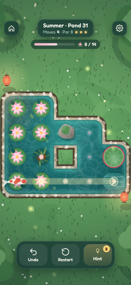 Koi Pond gameplay: a koi glides across a summer pond, leaving pink lotus blooms on every tile it passes